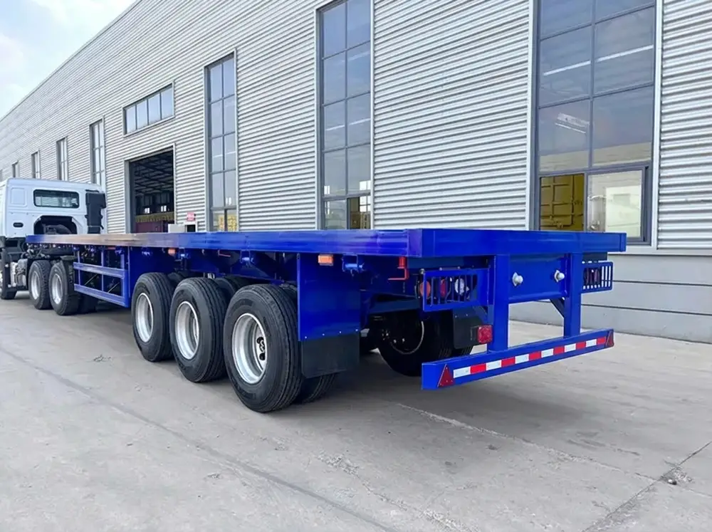 HUAYU 3-axle flatbed container semi trailer in factory yard