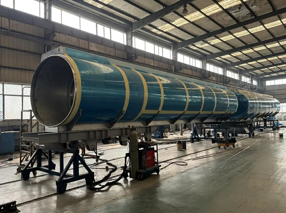 55 CBM tank body during manufacturing at HUAYU's Liangshan workshop — protective film still applied