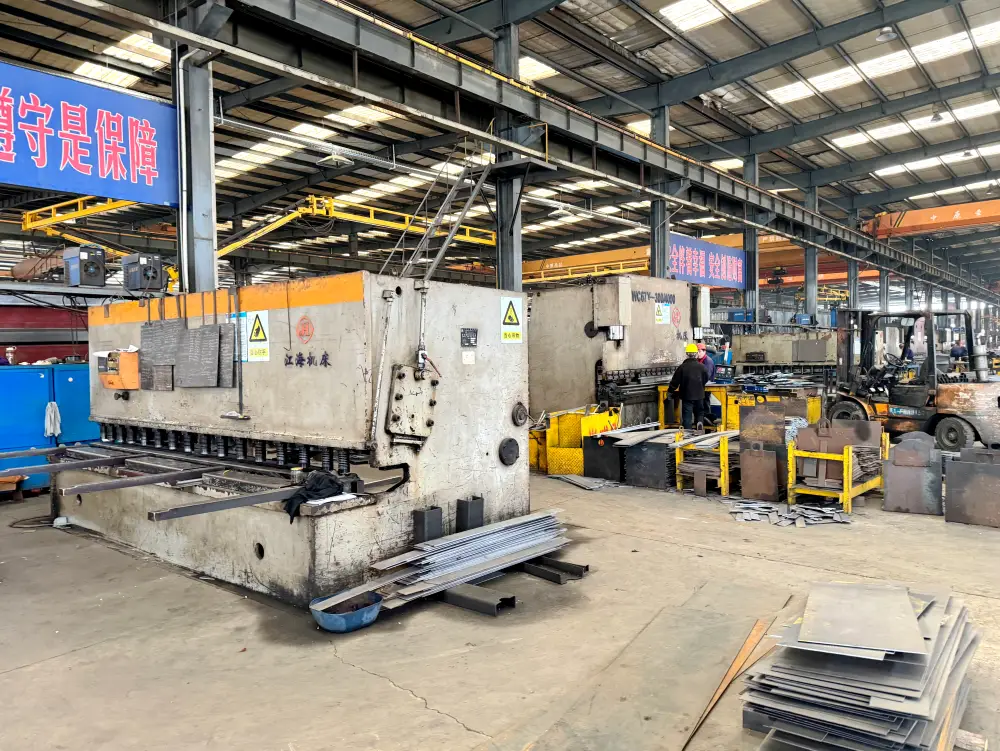 CNC plate shearing line and hydraulic press brakes on factory floor