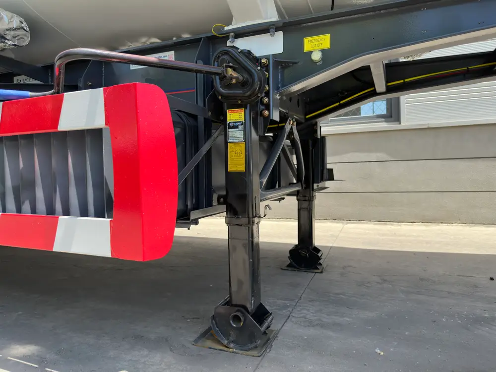 Two-speed landing gear with sand shoes and the emergency cut-off control labeled on the chassis rail.