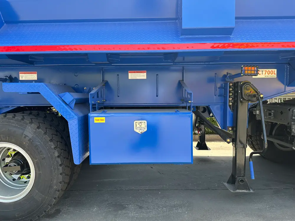 Lockable side-mount tool box and side underrun guard on the 3 axle heavy duty rear dump semi trailer.