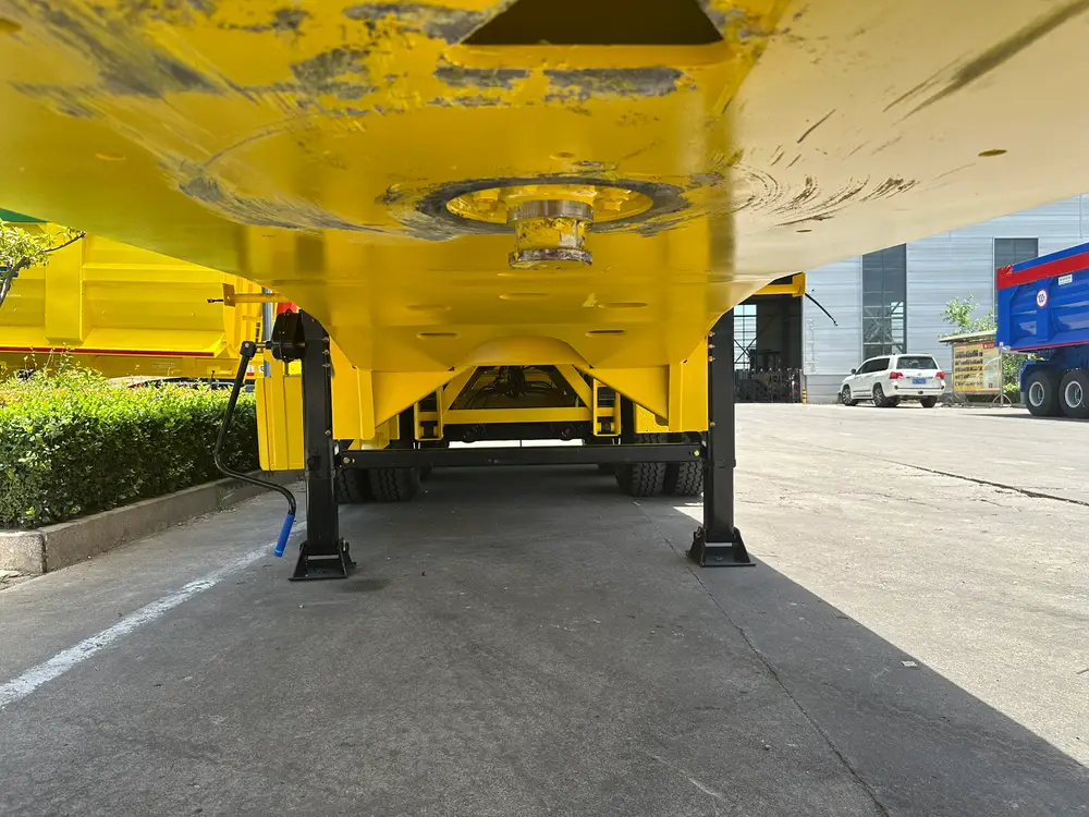 The bolted kingpin plate and body underfloor, with the two-speed landing gear dropped on the factory yard.