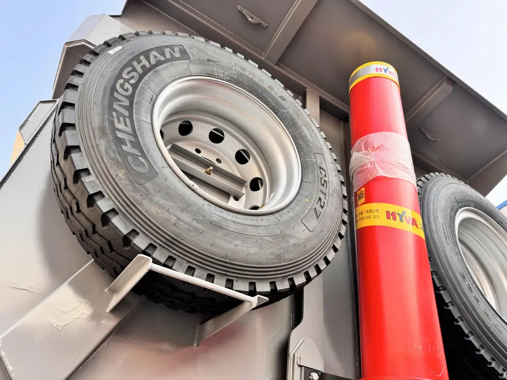 HYVA front telescopic cylinder with CHENGSHAN 13R22.5 tire close-up