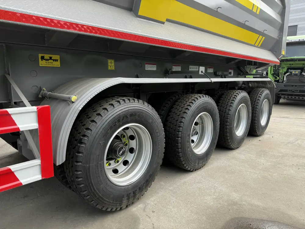 4 axle rock body dump trailer running gear with Triangle 12R22.5 mining tread tires and FUWA hubs