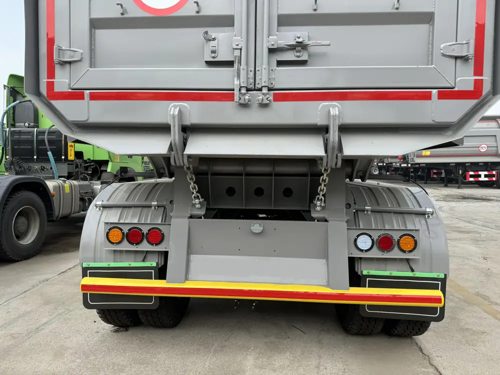 4 axle rock body trailer rear LED tail light cluster and yellow red reflective impact bumper