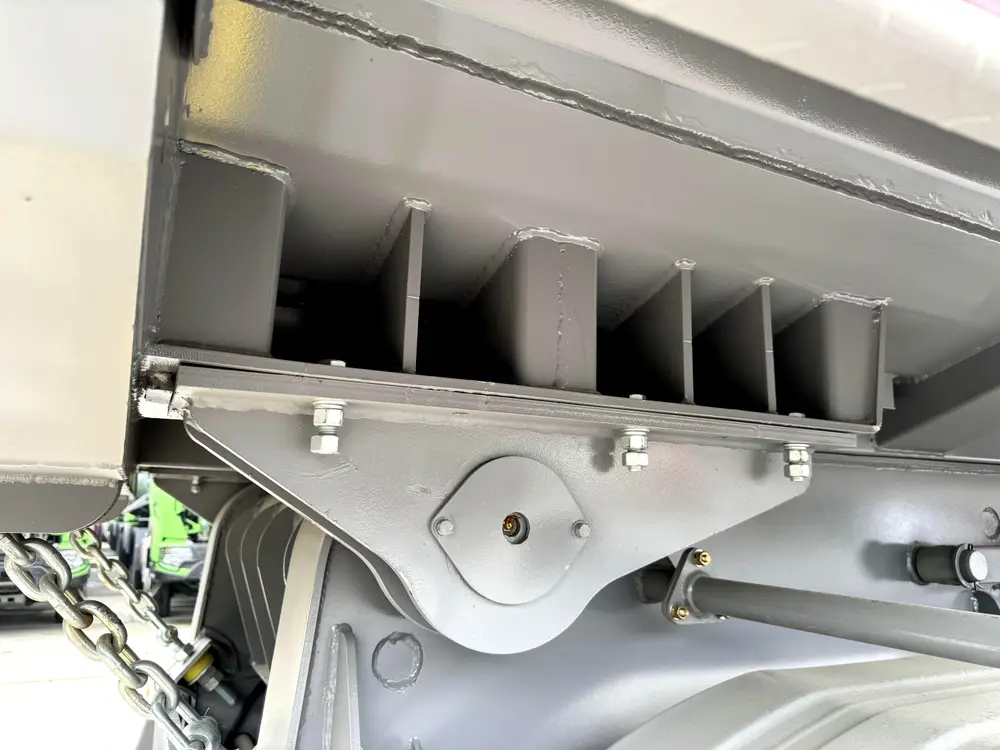 Rear body to chassis pivot hinge with reinforced mounting plate on 4 axle rock body trailer