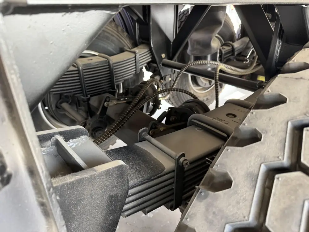 Mechanical leaf spring and brake chamber on rear axle