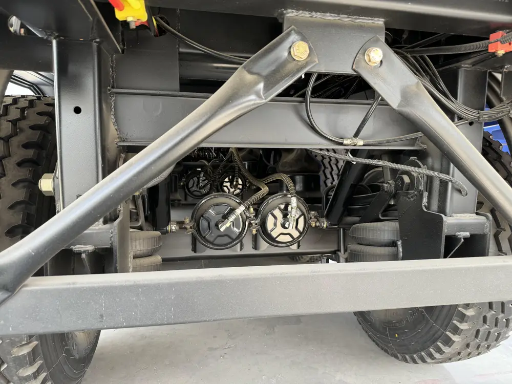 Chassis cross member with brake valves and air lines